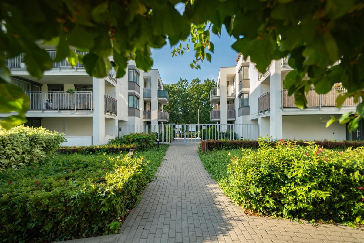 Apartment complex with landscaping and palm trees